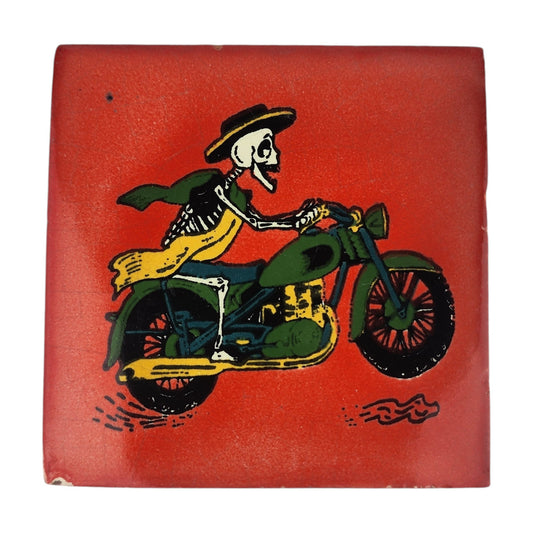 Skeleton Motorcycle ceramic tile with red background and colorful Mexican folk art design