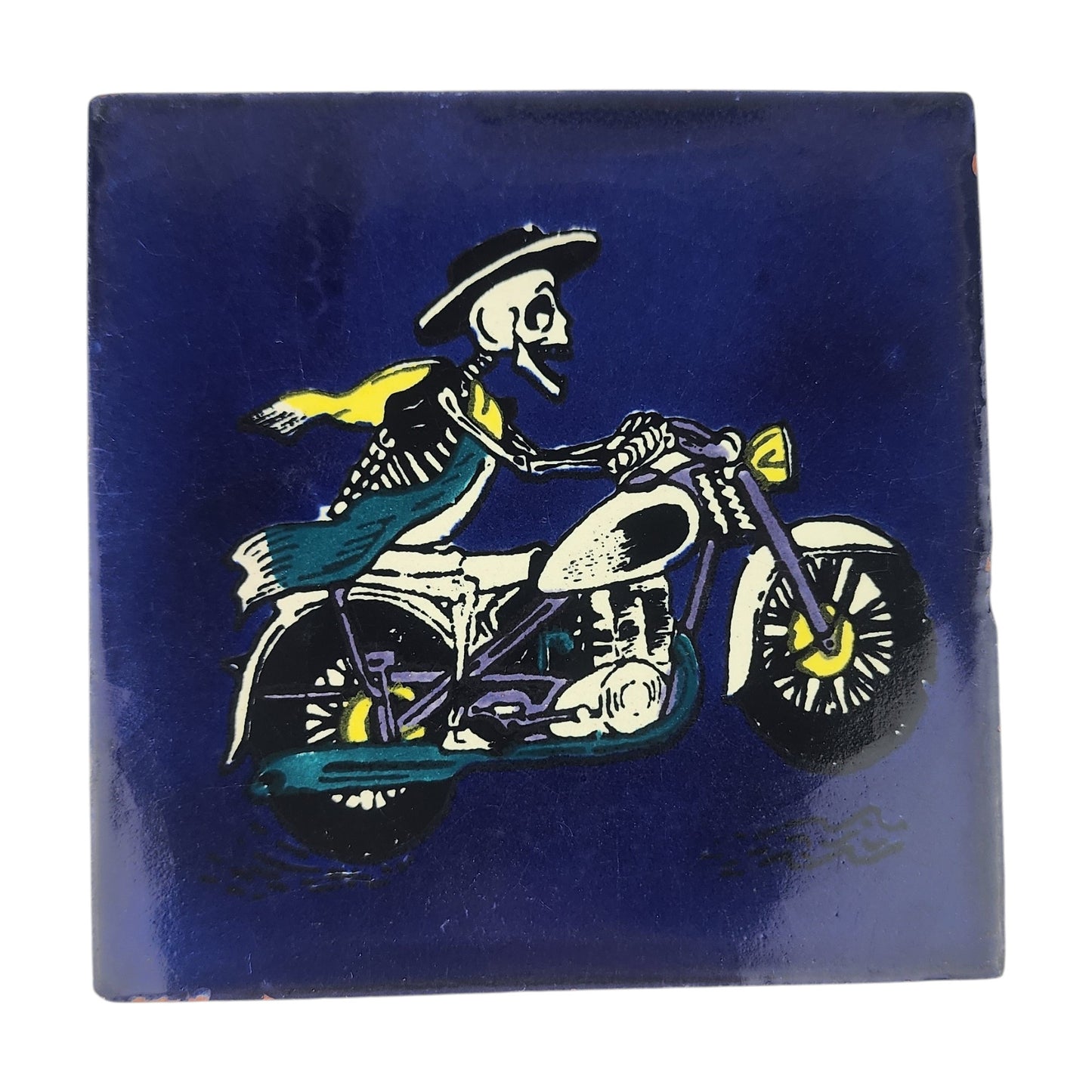 Skeleton Motorcycle ceramic tile with royal blue background and Mexican folk art design