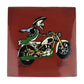 Skeleton Motorcycle ceramic tile with red brown background and Mexican folk art design