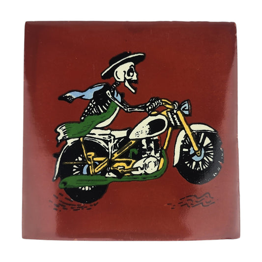 Skeleton Motorcycle ceramic tile with red brown background and Mexican folk art design