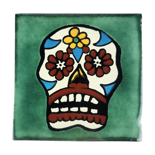 Floral sugar skull Mexican ceramic tile with green background and colorful flowers