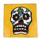 Floral sugar skull Mexican ceramic tile with mustard yellow background and colorful flowers