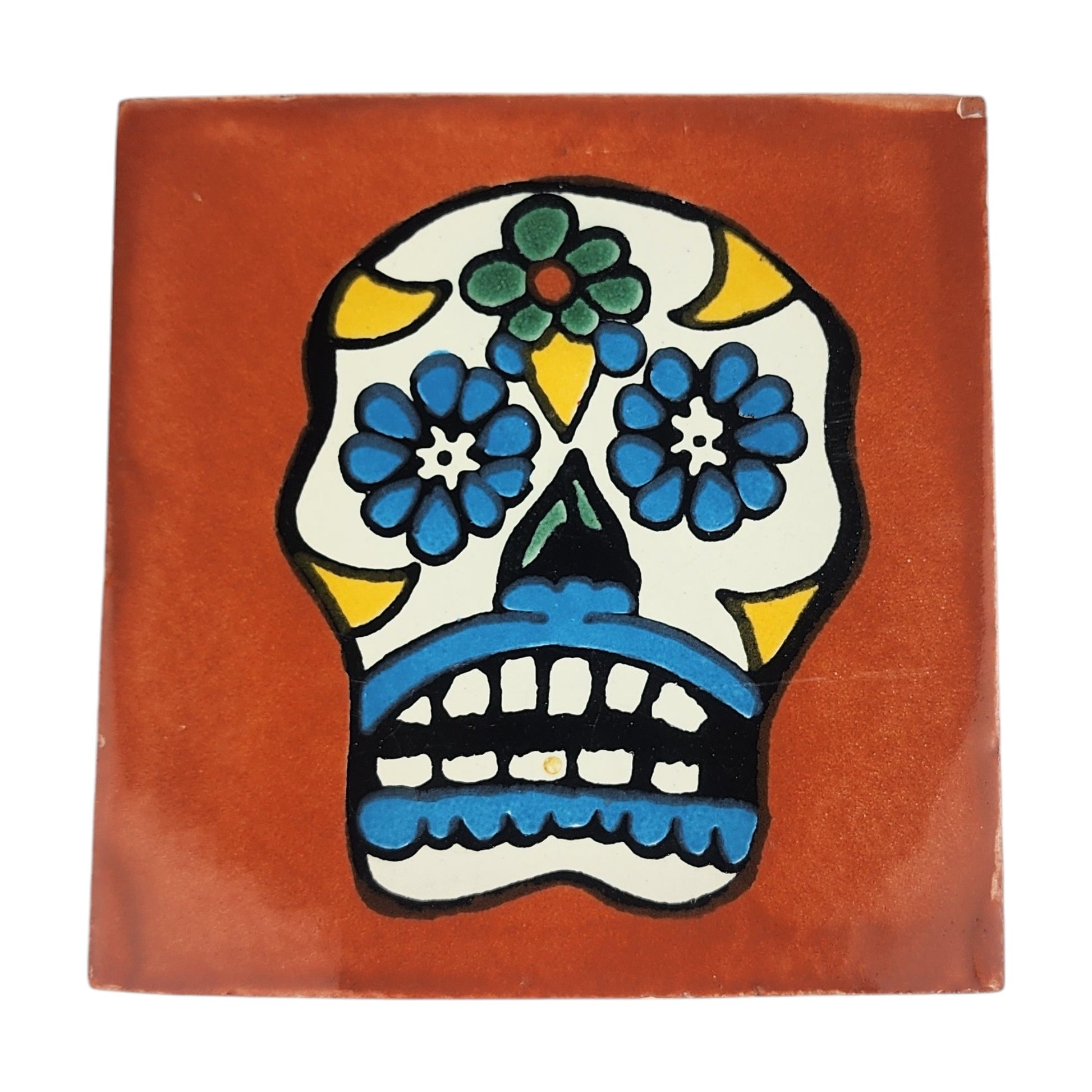 Floral sugar skull Mexican ceramic tile with blue flowers and copper brown background