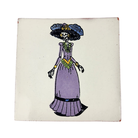 White Catrina ceramic tile with purple dress and Mexican folk art design