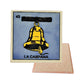 La Campana #43 Loteria ceramic coaster with bell card artwork and cork-backed reverse on a white background
