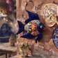 13-inch navy blue Talavera-style ceramic fish wall décor displayed on an outdoor wall, showcasing handcrafted Mexican folk art in a coastal-inspired setting.