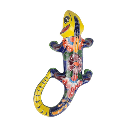 Yellow Talavera-style ceramic iguana with turquoise, green, orange, and red patterns displayed on a white background.