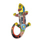 Yellow Talavera-style ceramic iguana with colorful floral and geometric patterns displayed on a white background.