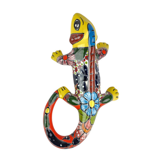 Yellow Talavera-style ceramic iguana with colorful floral and geometric patterns displayed on a white background.