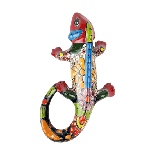 Red Talavera-style ceramic iguana with blue, yellow, green, and white patterns displayed on a white background.