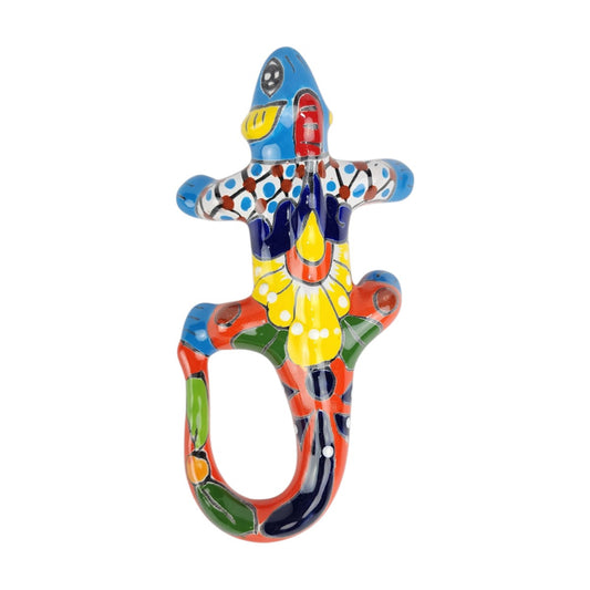 Sky blue Talavera-style ceramic iguana with red, yellow, green, orange, and white patterns on a white background.