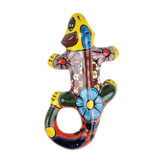 Yellow Talavera-style ceramic iguana with colorful floral and geometric patterns displayed on a white background.