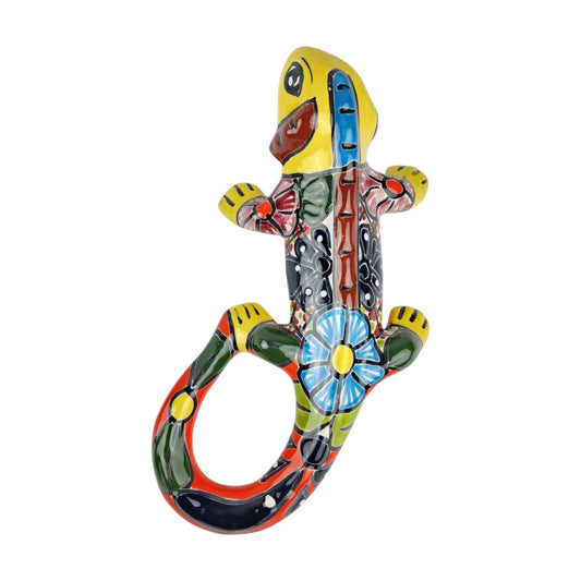 Yellow Talavera-style ceramic iguana with colorful floral and geometric patterns displayed on a white background.
