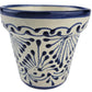 Ceramic pot with blue and white pattern on a white background
