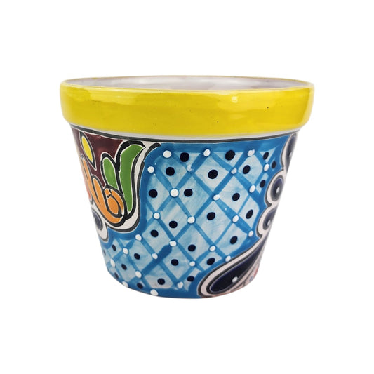 Yellow rim ceramic planter with a sky blue lattice pattern, deep blue dots, white highlights, green accents, and golden-orange scrollwork.
