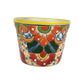 Yellow rim Talavera-style ceramic planter with orange green and blue floral artwork