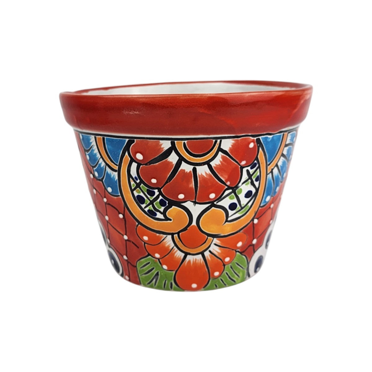Red rim ceramic planter with red and orange flowers, golden-orange scrollwork, blue petals, green leaves, crosshatched panels, and white dots.
