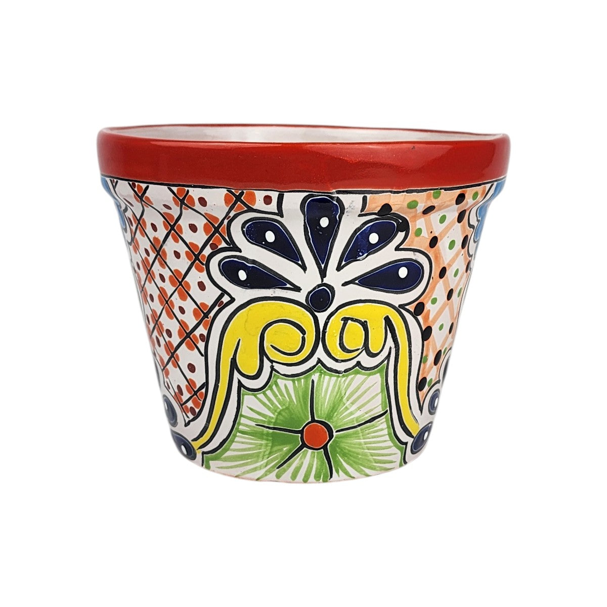Red rim ceramic planter with deep blue teardrop petals, yellow scrollwork, a green flower with an orange center, and dotted lattice panels.
